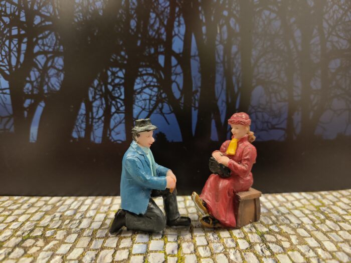 Man bindt schaatsen onder - Afbeelding 1