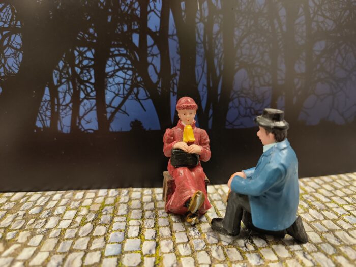 Man bindt schaatsen onder - Afbeelding 2