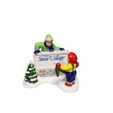 Kids decorating the village sign